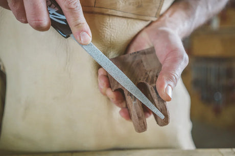man using kutzall hand rasp